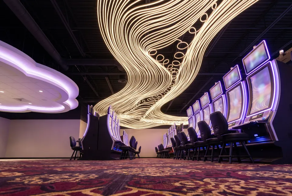 Slot floor under ribbon lights at ACE Casino Red Deer